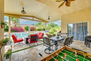 a patio with a pool table and chairs at Private Pool and Patio Desert Hot Springs Retreat in Desert Hot Springs
