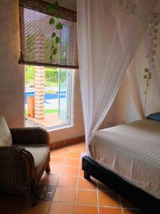 Voodi või voodid majutusasutuse Coccoloba Hotel toas