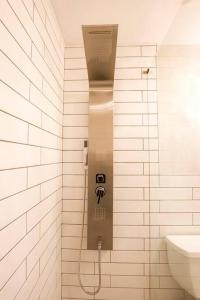 a shower stall in a bathroom with a sink at TOP RATED! Namaste Here steps to Flagler & Beach in New Smyrna Beach +14 photos