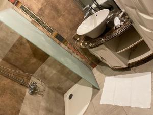 a bathroom with a sink and a toilet at amazing apartment in the most luxurious area of ​​the Fifth Settlement in Cairo