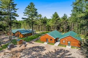 an aerial view of a cabin in the woods at The Fish in Conover