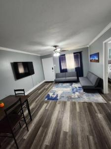 a living room with a couch and a table at Blue Shark *G1* @ Montrose Urban 1BR King Apartment in Houston