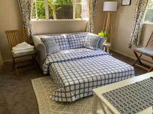 a living room with a couch and a chair at The Ground Floor Guest Suite in Dunedin