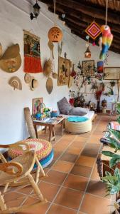 a room with chairs and other items on the wall at La Casona Espacio Bonito in Zapatoca