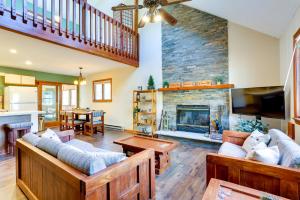 a living room with couches and a fireplace at Rustic Masthope Mountain Retreat with Private Sauna! in Hawley