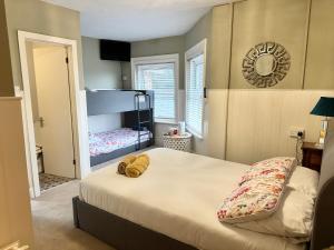 a bedroom with a bed and a bunk bed at The Boho - 4 min walk to beach & town in Bournemouth