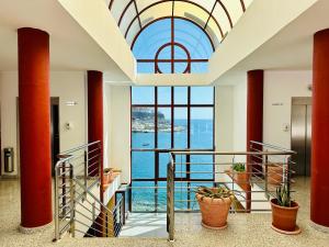 a hallway with a view of the ocean from a building at APARTMENT WITH OCEAN VIEW in Playa del Cura