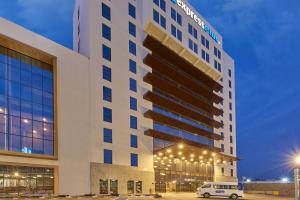 a building with a van parked in front of it at City Express Plus by Marriott Leon Centro de Convenciones in León