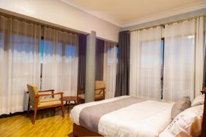 Ένα ή περισσότερα κρεβάτια σε δωμάτιο στο Bwizi Resort and Gardens