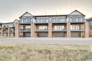 an exterior view of a large apartment building at Modern Bozeman Escape with Bridger Mountain Views! in Bozeman