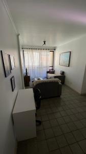 a living room with a couch and a table at Apartamento Atalaia Aracaju in Aracaju