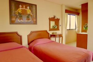 Postel nebo postele na pokoji v ubytování Fulay Hotel