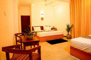 Кровать или кровати в номере Tevins Place - Unawatuna