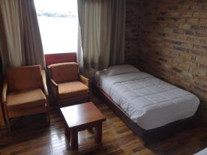 Postel nebo postele na pokoji v ubytování Hotel Refugio Santa Ines
