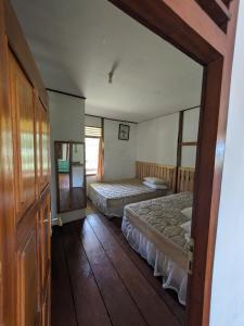 Ліжко або ліжка в номері Villa Kana