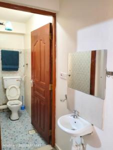 Ein Badezimmer in der Unterkunft Christie's apartments Buruburu