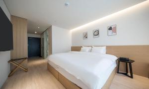 Pohang Hotel Noblion客房内的一张或多张床位