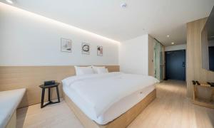Pohang Hotel Noblion客房内的一张或多张床位