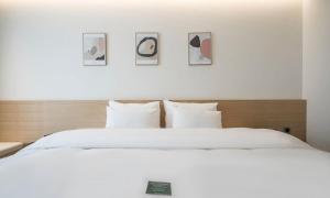 Pohang Hotel Noblion客房内的一张或多张床位