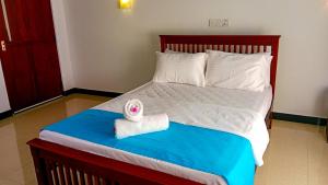 Postel nebo postele na pokoji v ubytování Ceylon Amigos Eco Resort