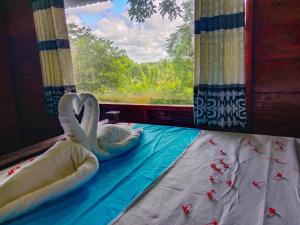 Postel nebo postele na pokoji v ubytování Ceylon Amigos Eco Resort
