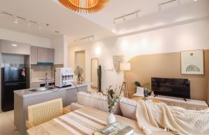 a living room with a couch and a table at 10 min to My town family unit By Nexx Field in Kuala Lumpur