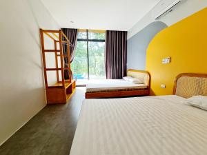 Ein Bett oder Betten in einem Zimmer der Unterkunft Villa Ba Vi 6 Bedrooms & Pool DC Green Resort