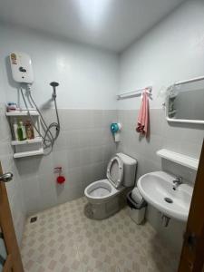 a small bathroom with a toilet and a sink at ปางอ่ายแคมป์ปิ้ง in Ban Pang Ai