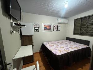 Ένα ή περισσότερα κρεβάτια σε δωμάτιο στο Casa Recanto - Quarto simples