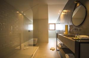 a bathroom with a sink and a mirror at Somewhere - Estoril Guesthouse in Estoril