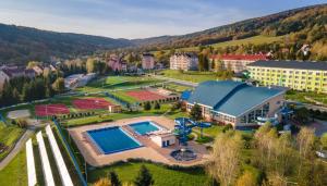 an aerial view of a resort with a swimming pool at Cisza in Ustrzyki Dolne