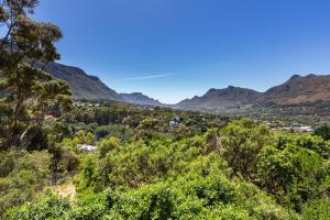a view of a valley with mountains in the background at Elite Retreats - Hillside Villa 2 - power backup in Cape Town