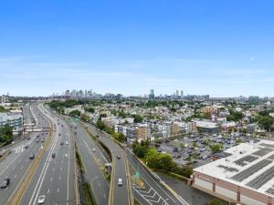an aerial view of a city with a highway at Stunning 2BR Condo in Assembly Square East Somerville in Somerville