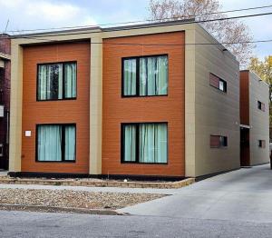 a building with windows on the side of it at KCM Mikros Smart Apartments 3 in Cleveland