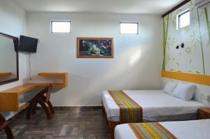 Letto o letti in una camera di Hotel Axolotl