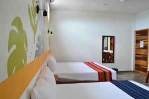 Letto o letti in una camera di Hotel Axolotl
