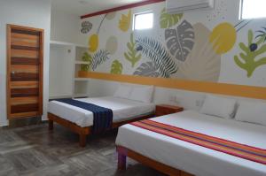 Letto o letti in una camera di Hotel Axolotl
