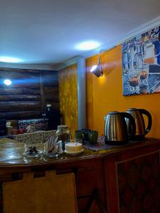 a kitchen with a counter with pots and pans on it at Communication hostel in Batumi