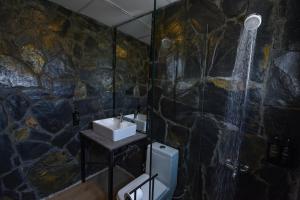 a bathroom with a sink and a shower at LOKAL Rooms x Skardu (Katpana Retreat) in Skardu