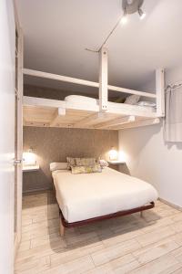 a bedroom with a bed with two bunk beds at LUZ in Sierra Nevada