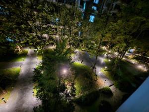 an overhead view of a park at night with lights at Studio view Garden - Room in Phra Nakhon Si Ayutthaya