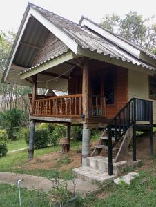 a small house with a porch and a deck at Mookanda bungalow in Ko Yao Noi