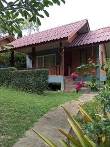 a house with a red tile roof at Mookanda bungalow in Ko Yao Noi