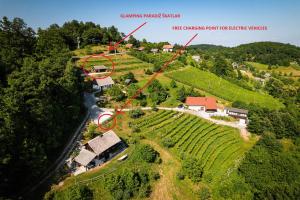 an aerial view of a house on a farm at Glamping Paradise Škatlar in Otočec