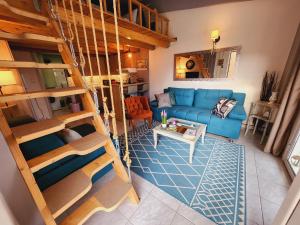 an overhead view of a living room with a blue couch at Luxury Loft Apartment Sofia in Patra