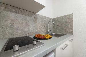 Kuchyňa alebo kuchynka v ubytovaní Apartments Lacrima
