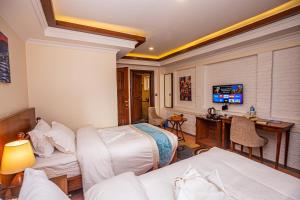 Voodi või voodid majutusasutuse Darbar Heritage Inn toas