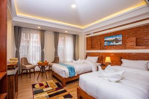 Voodi või voodid majutusasutuse Darbar Heritage Inn toas