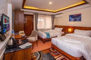 Voodi või voodid majutusasutuse Darbar Heritage Inn toas