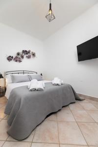 Posteľ alebo postele v izbe v ubytovaní Apartments Lacrima